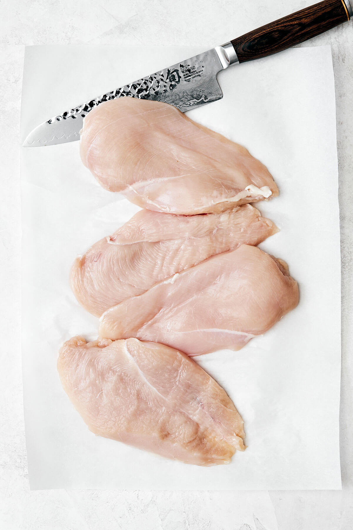 Chicken piccata is the best Italian-American dinner made with golden-crusted chicken breasts simmered in a lemon garlic wine sauce. Sliced chicken breasts for chicken piccata