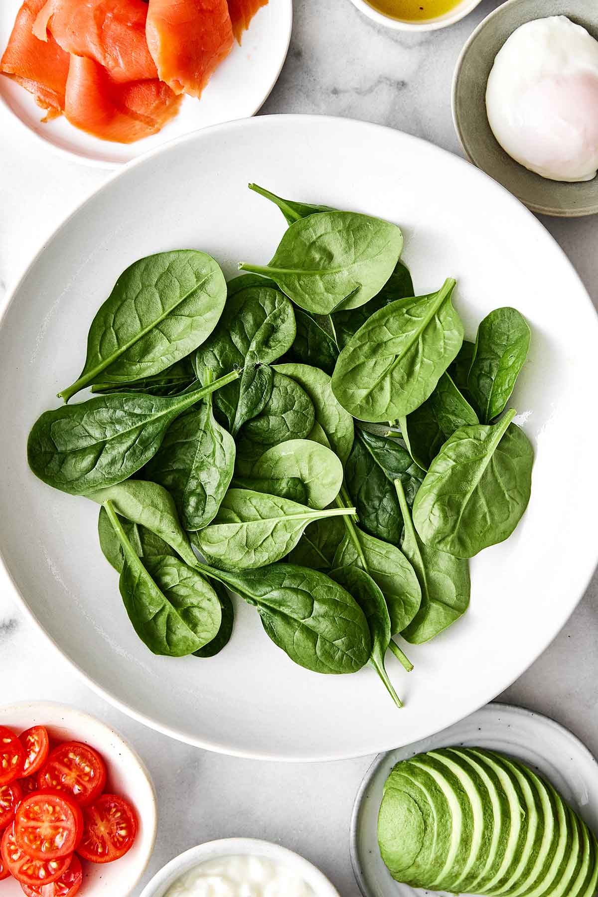 This is the clean and lean protein bowl I make regularly for breakfast! It's high-protein, fiber-forward, and so easy to assemble. Assembling a high-protein breakfast bowl.