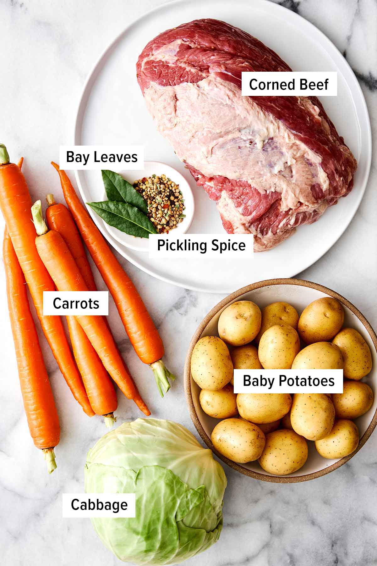 Celebrate St. Patrick's Day with the best corned beef and cabbage! Juicy brisket, creamy horseradish sauce, and hearty veggies. Ingredients for corned beef and cabbage.