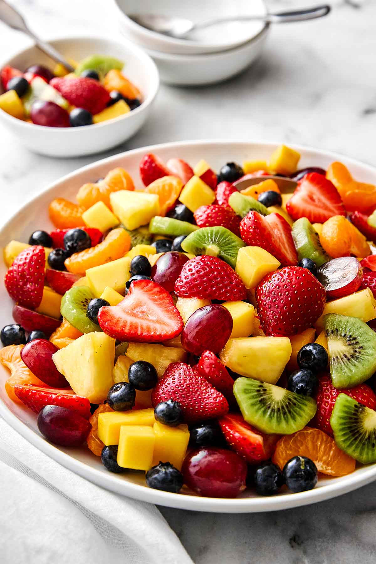 drizzle the honey lime dressing over the fruit and gently toss everything together until evenly coated. That’s it! Classic fruit salad.