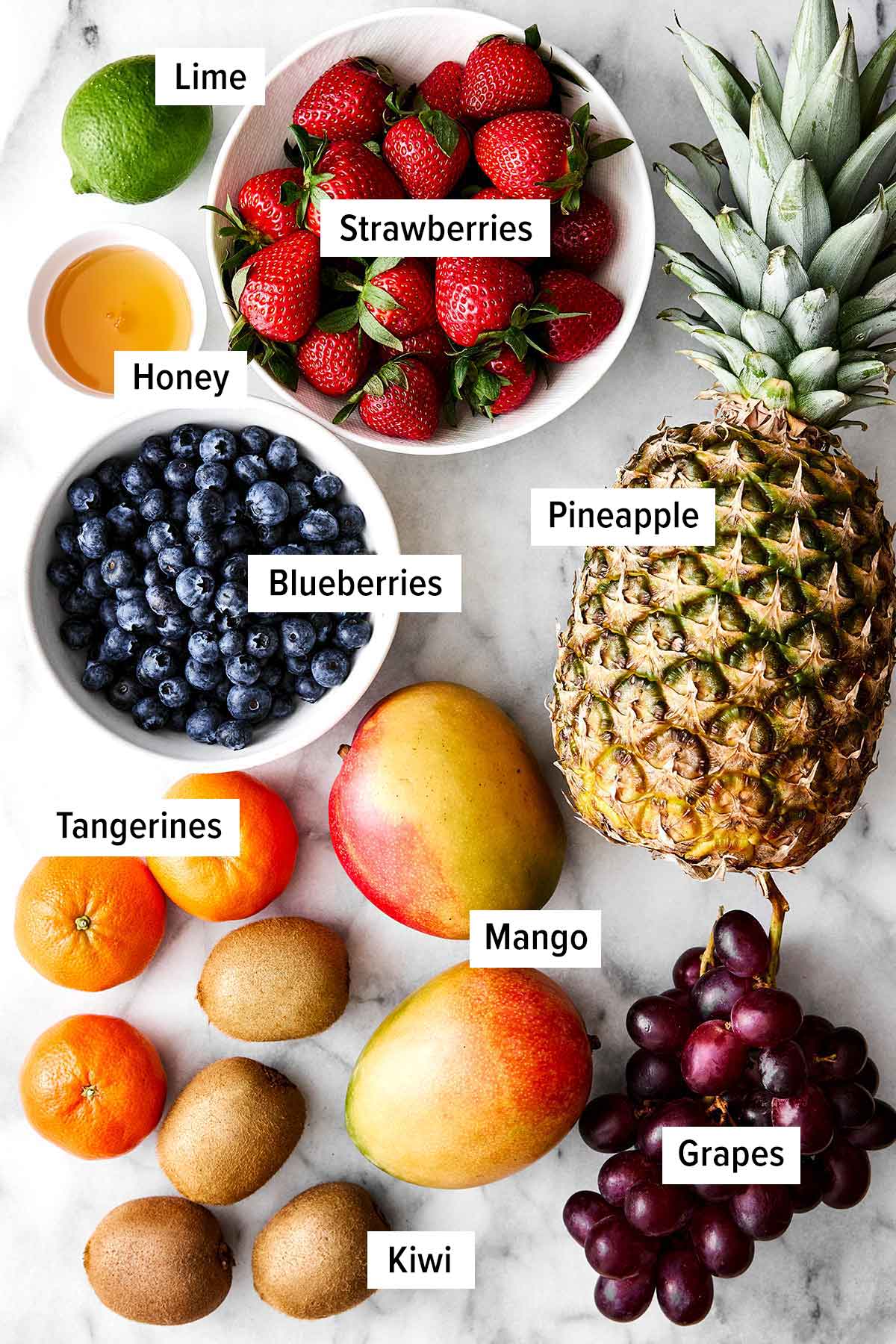 A crowd-favorite fruit salad for BBQs and potlucks! It's incredibly simple with juicy seasonal fruit tossed in a honey lime dressing. Fruit salad ingredients.