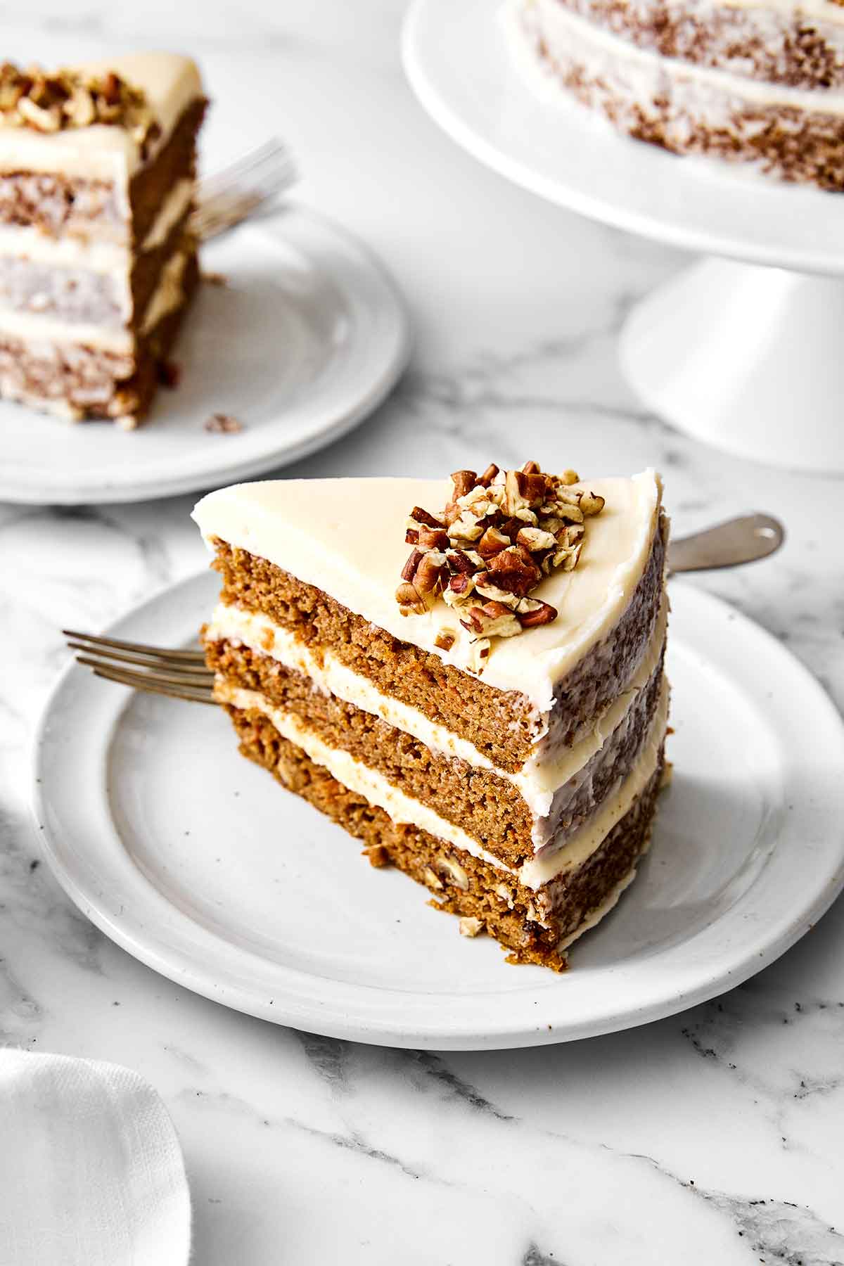 This gluten-free carrot cake has been a reader favorite for years! It’s made with three layers of perfectly spiced carrot cake and just the right amount of cream cheese frosting for a deliciously sweet bite. Gluten-free carrot cake.