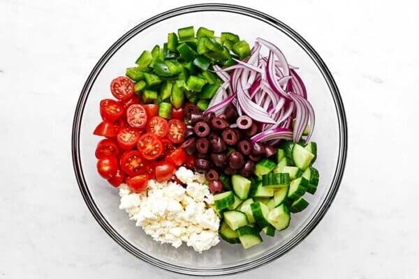 A bowl of Greek salad ingredients