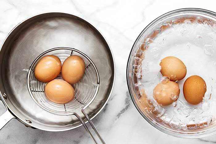 Boiled eggs in a pot.