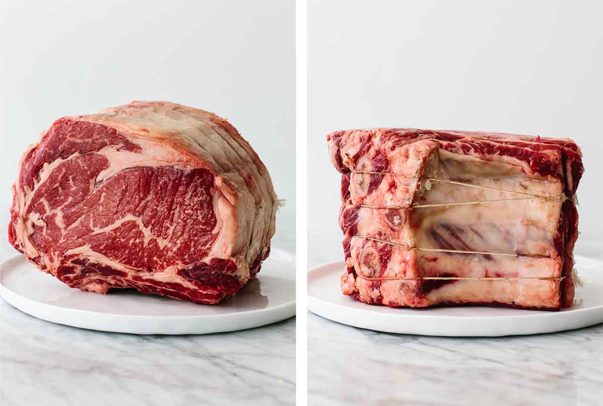 Raw prime rib on a plate on a table.