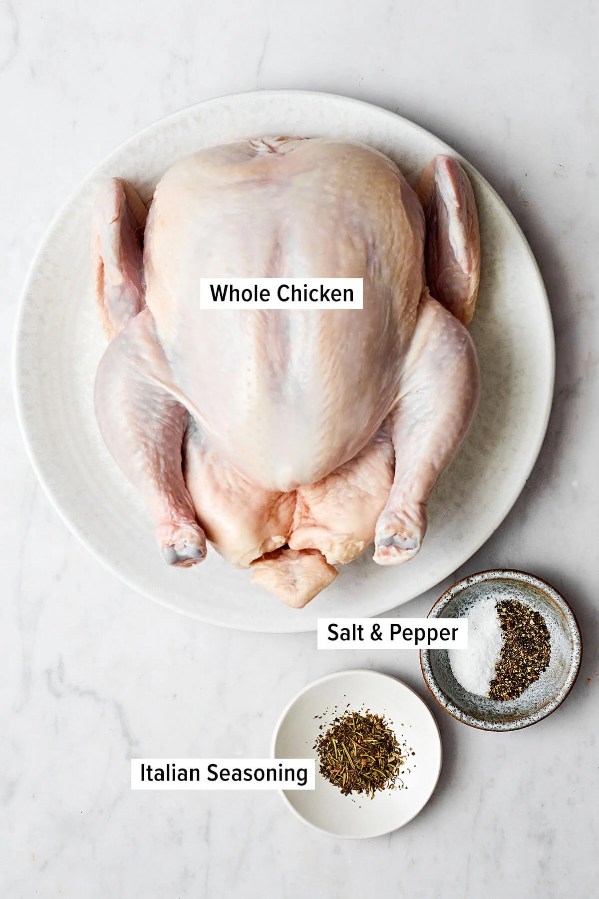 Learning how to roast chicken is the ultimate kitchen staple. It's easy to make, feeds a surplus, and can be served in dozens of ways! Ingredients for roast chicken on a table
