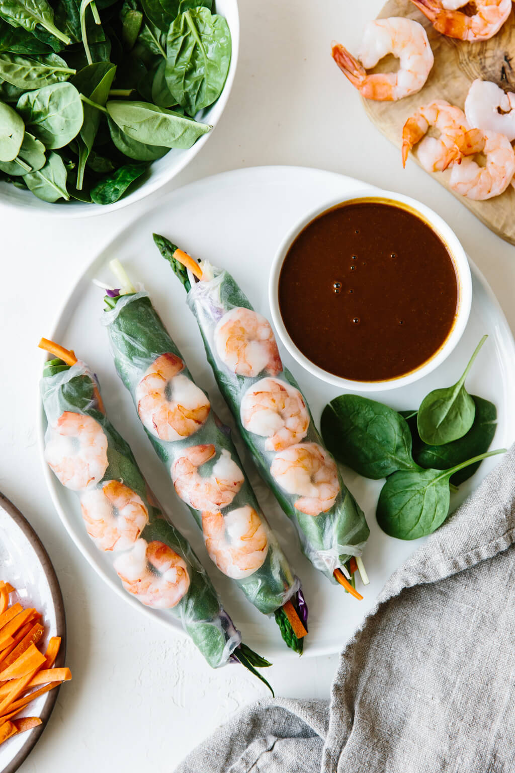 Three Vietnamese spring rolls on a plate.